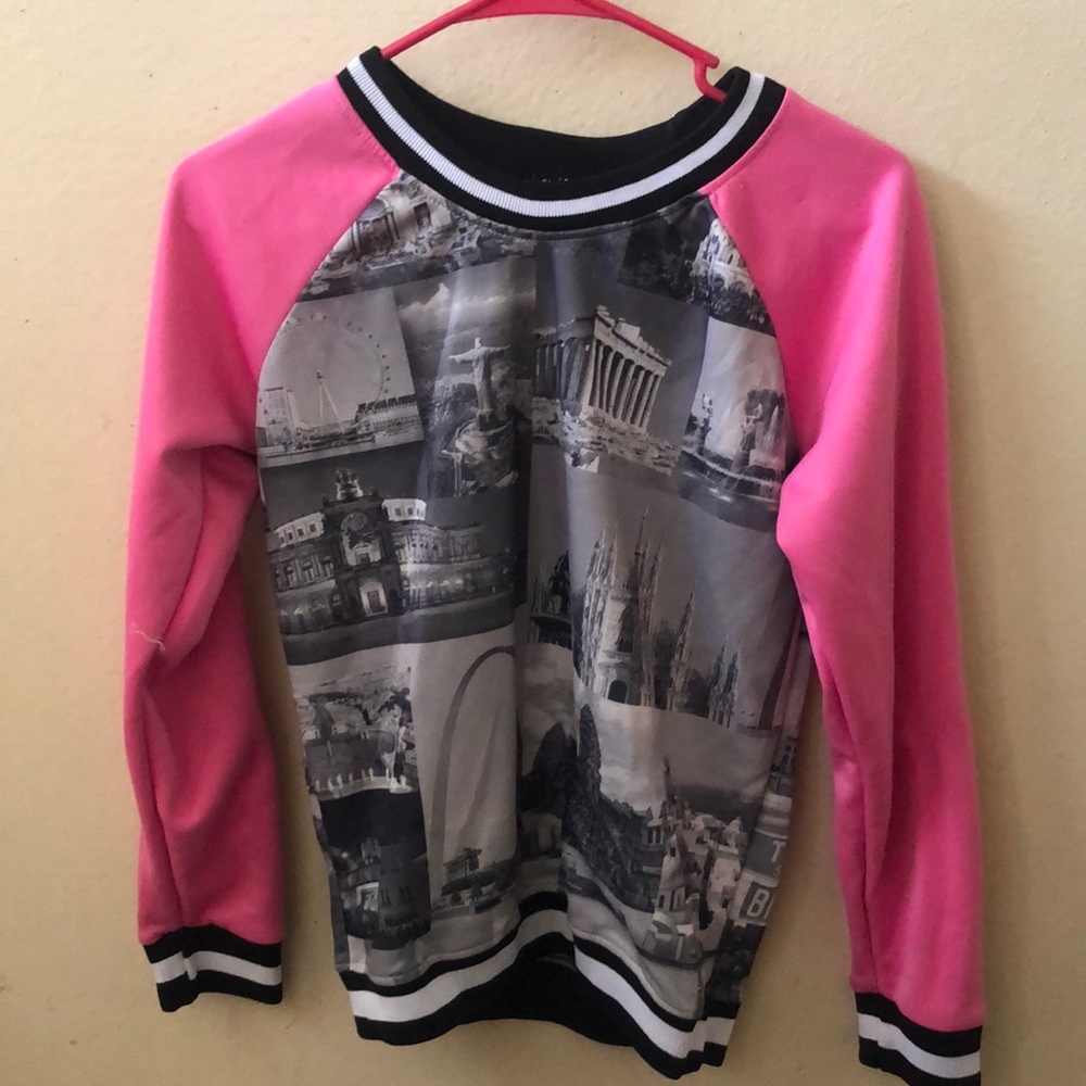 A pink and black sweater